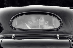 Wedding couple and old car